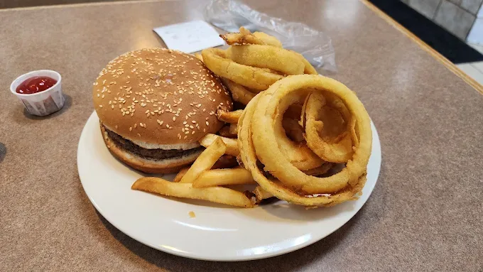 Cheeseburger with french fries and golden onion rings